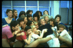 Director/choreographer Gower Champion surrounded by chorus girls during a rehearsal for the Broadway production of the musical "42nd Street." (New York)