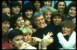 Director/choreographer Gower Champion surrounded by chorus girls during a rehearsal for the Broadway production of the musical "42nd Street." (New York)