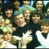Director/choreographer Gower Champion surrounded by chorus girls during a rehearsal for the Broadway production of the musical "42nd Street." (New York)