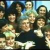Director/choreographer Gower Champion surrounded by chorus girls during a rehearsal for the Broadway production of the musical "42nd Street." (New York)