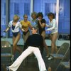 Director/choreographer Gower Champion surrounded by chorus girls during a rehearsal for the Broadway production of the musical "42nd Street." (New York)