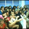 Director/choreographer Gower Champion surrounded by chorus girls during a rehearsal for the Broadway production of the musical "42nd Street." (New York)