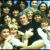 Director/choreographer Gower Champion surrounded by chorus girls during a rehearsal for the Broadway production of the musical "42nd Street." (New York)