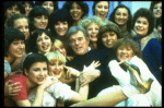 Director/choreographer Gower Champion surrounded by chorus girls during a rehearsal for the Broadway production of the musical "42nd Street." (New York)