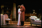 Actor Richard Burton about to kiss actress ex-wife Elizabeth Taylor in scene fromBroadway play "Pivate Lives".