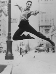 Director-choreographer Michael Bennett leaping in the air as a teenager in Times Square.