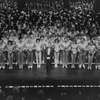 Broadway director-choreographer Michael Bennett with the collective cast of "A Chorus Line, " gathered to perform a giant version of the show to celebrate its becoming Broadway's longest running show.