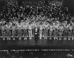 Broadway director-choreographer Michael Bennett with the collective cast of "A Chorus Line, " gathered to perform a giant version of the show to celebrate its becoming Broadway's longest running show.