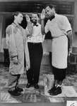 Actors Lonny Price and Danny Glover saluting each other as actor Zakes Mokae looks on during scene from Athol Fugard's play "Master Harold... and the Boys"