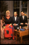 L-R) Actors Sally Struthers, Lewis J. Stadlen and Tony Shalhoub in a scene from the Broadway revival of the play "The Odd Couple." (New York)