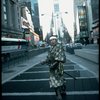 A castmember from the Broadway production of the musical "Pacific Overtures" posing in the middle of Times Square to advertise the show. (New York)