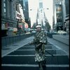 A castmember from the Broadway production of the musical "Pacific Overtures" posing in the middle of Times Square to advertise the show. (New York)