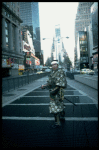 A castmember from the Broadway production of the musical "Pacific Overtures" posing in the middle of Times Square to advertise the show. (New York)