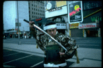 A castmember from the Broadway production of the musical "Pacific Overtures" posing in the middle of Times Square to advertise the show. (New York)