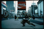 A castmember from the Broadway production of the musical "Pacific Overtures" posing in the middle of Times Square to advertise the show. (New York)