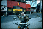 A castmember from the Broadway production of the musical "Pacific Overtures" posing in the middle of Times Square to advertise the show. (New York)