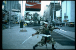 A castmember from the Broadway production of the musical "Pacific Overtures" posing in the middle of Times Square to advertise the show. (New York)