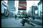 A castmember from the Broadway production of the musical "Pacific Overtures" posing in the middle of Times Square to advertise the show. (New York)