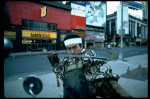 A castmember from the Broadway production of the musical "Pacific Overtures" posing in the middle of Times Square to advertise the show. (New York)