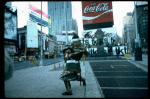 A castmember from the Broadway production of the musical "Pacific Overtures" posing in the middle of Times Square to advertise the show. (New York)