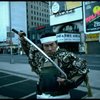 A castmember from the Broadway production of the musical "Pacific Overtures" posing in the middle of Times Square to advertise the show. (New York)