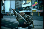 A castmember from the Broadway production of the musical "Pacific Overtures" posing in the middle of Times Square to advertise the show. (New York)