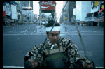 A castmember from the Broadway production of the musical "Pacific Overtures" posing in the middle of Times Square to advertise the show. (New York)