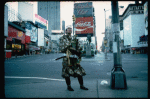 A castmember from the Broadway production of the musical "Pacific Overtures" posing in the middle of Times Square to advertise the show. (New York)