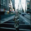 A castmember from the Broadway production of the musical "Pacific Overtures" posing in the middle of Times Square to advertise the show. (New York)