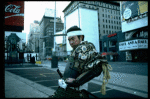 A castmember from the Broadway production of the musical "Pacific Overtures" posing in the middle of Times Square to advertise the show. (New York)