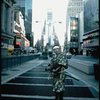 A castmember from the Broadway production of the musical "Pacific Overtures" posing in the middle of Times Square to advertise the show. (New York)