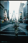 A castmember from the Broadway production of the musical "Pacific Overtures" posing in the middle of Times Square to advertise the show. (New York)