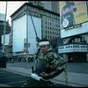 A castmember from the Broadway production of the musical "Pacific Overtures" posing in the middle of Times Square to advertise the show. (New York)