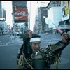 A castmember from the Broadway production of the musical "Pacific Overtures" posing in the middle of Times Square to advertise the show. (New York)