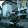 A castmember from the Broadway production of the musical "Pacific Overtures" posing in the middle of Times Square to advertise the show. (New York)