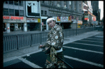 A castmember from the Broadway production of the musical "Pacific Overtures" posing in the middle of Times Square to advertise the show. (New York)