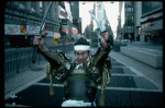 A castmember from the Broadway production of the musical "Pacific Overtures" posing in the middle of Times Square to advertise the show. (New York)