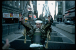 A castmember from the Broadway production of the musical "Pacific Overtures" posing in the middle of Times Square to advertise the show. (New York)