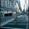 A castmember from the Broadway production of the musical "Pacific Overtures" posing in the middle of Times Square to advertise the show. (New York)