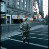 A castmember from the Broadway production of the musical "Pacific Overtures" posing in the middle of Times Square to advertise the show. (New York)