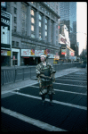 A castmember from the Broadway production of the musical "Pacific Overtures" posing in the middle of Times Square to advertise the show. (New York)