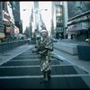 A castmember from the Broadway production of the musical "Pacific Overtures" posing in the middle of Times Square to advertise the show. (New York)