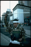 A castmember from the Broadway production of the musical "Pacific Overtures" posing in the middle of Times Square to advertise the show. (New York)