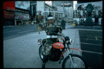 A castmember from the Broadway production of the musical "Pacific Overtures" posing in the middle of Times Square to advertise the show. (New York)