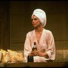 Actress Christine Baranski (in bathrobe and with towel wrapped around her head) holding a beer and a cigarette  in a scene from the Broadway production of the play "The Real Thing." (New York)