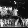 A scene from the Broadway show "City of Angels" featuring actors (L-R) James Naughton, Dee Hoty and Gregg Edelman (in the crane).