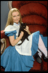 Actress Kate Burton w. cat in a publicity shot fr. the Broadway revival of "Alice in Wonderland."