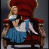 Actress Kate Burton w. cat in a publicity shot fr. the Broadway revival of "Alice in Wonderland."