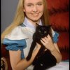 Actress Kate Burton w. cat in a publicity shot fr. the Broadway revival of "Alice in Wonderland."