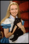 Actress Kate Burton w. cat in a publicity shot fr. the Broadway revival of "Alice in Wonderland."